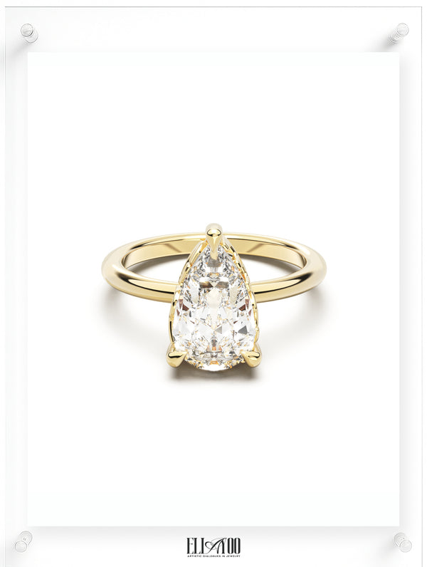 Front view of Pear Cut Diamond Ring with claw setting featuring initials on the side