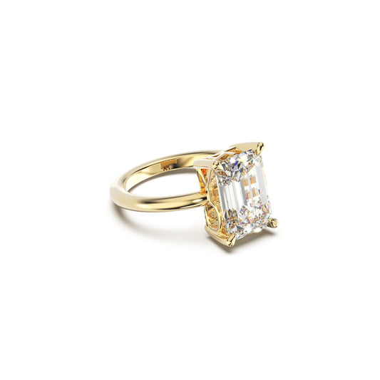 Gold ring with a diamond on a white background