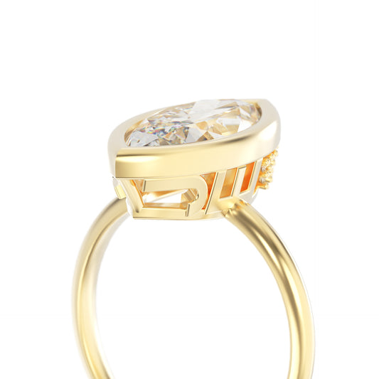 Gold ring with a large diamond on a white background