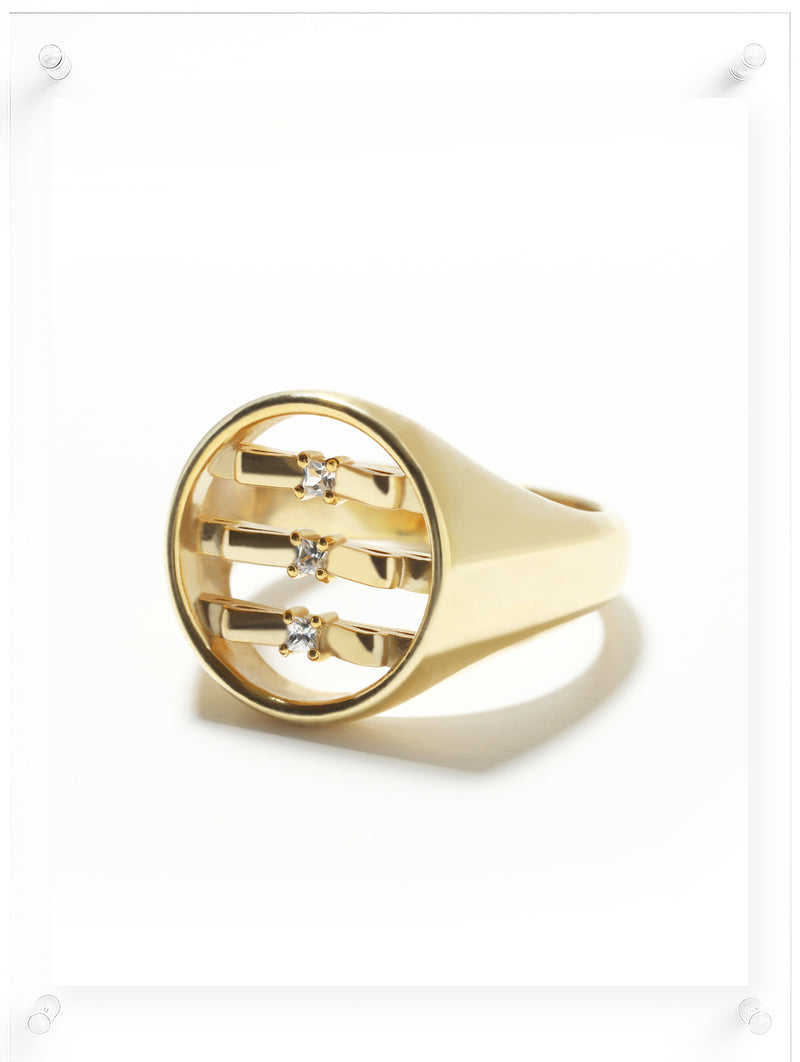 Side image of 10k gold signet ring featuring ribbon shape with White Diamond