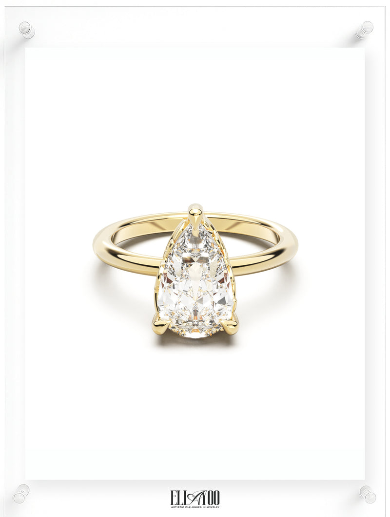Front view of Pear Cut Diamond Ring with claw setting featuring initials on the side