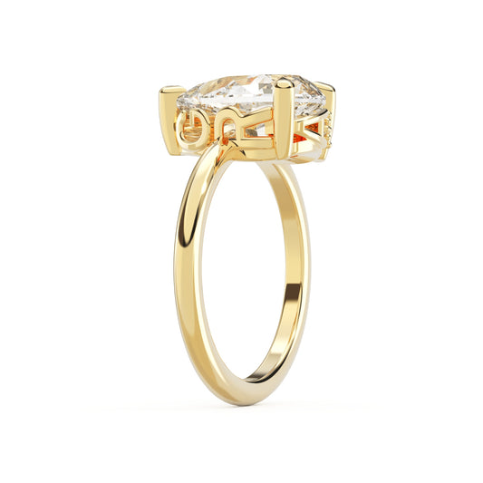 Upright side view of Pear Cut Diamond Ring with claw setting featuring initials on the side