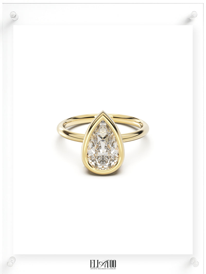 Front view of Pear Cut Diamond Ring with bezel setting featuring initials on the side