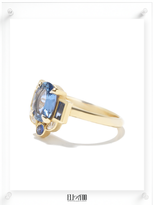 Side shot of Blue Sapphire Gold Ring  featuring asymmetrical halo design