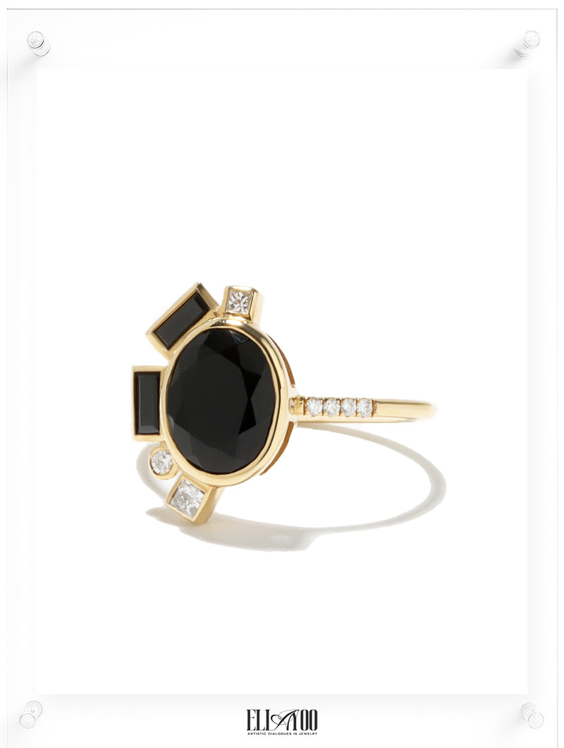 Side shot of Onyx Gold Ring featuring asymmetrical halo style