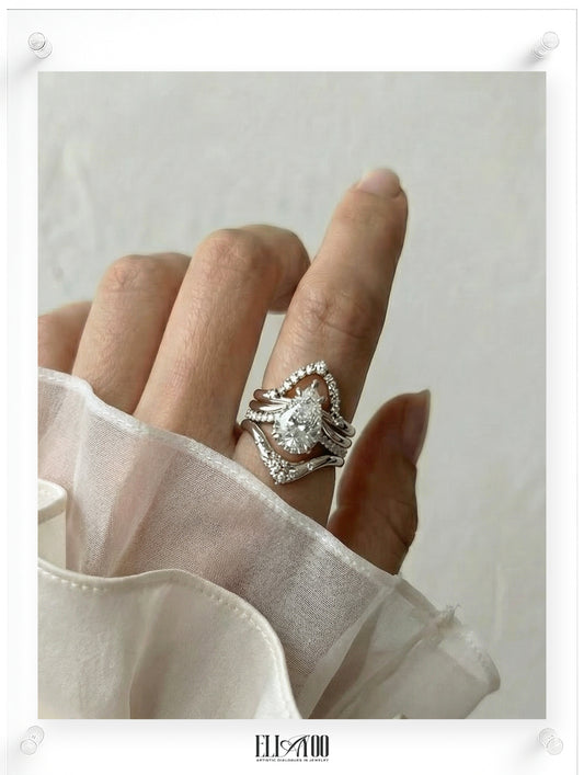 Pear cut diamond engagement ring with pavé band in 14k white gold, model shot