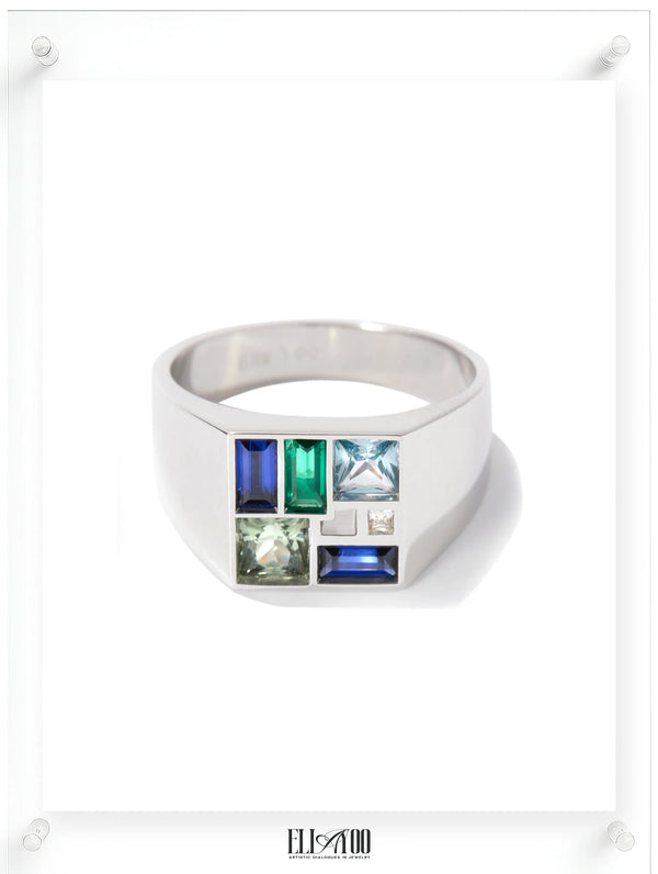 Modern white gold signet ring with a rectangular face showcasing a colorful gemstone mosaic inlay in blue, green, and light aqua.