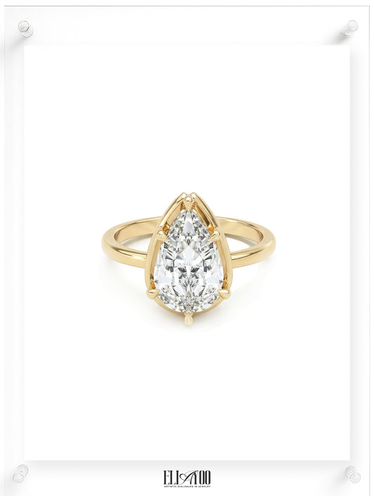 Front view of Pear cut diamond yellow gold ring