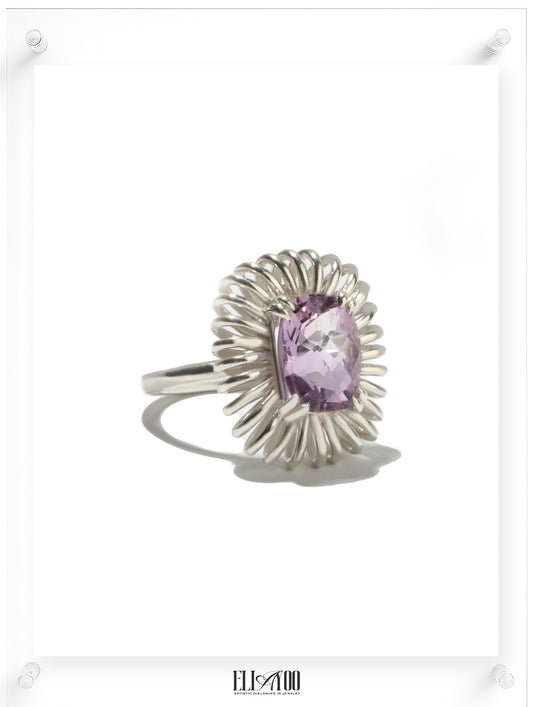 Side view of Elongated Cushion cut Amethyst ring with sculptural silver petal setting, contemporary art-inspired design