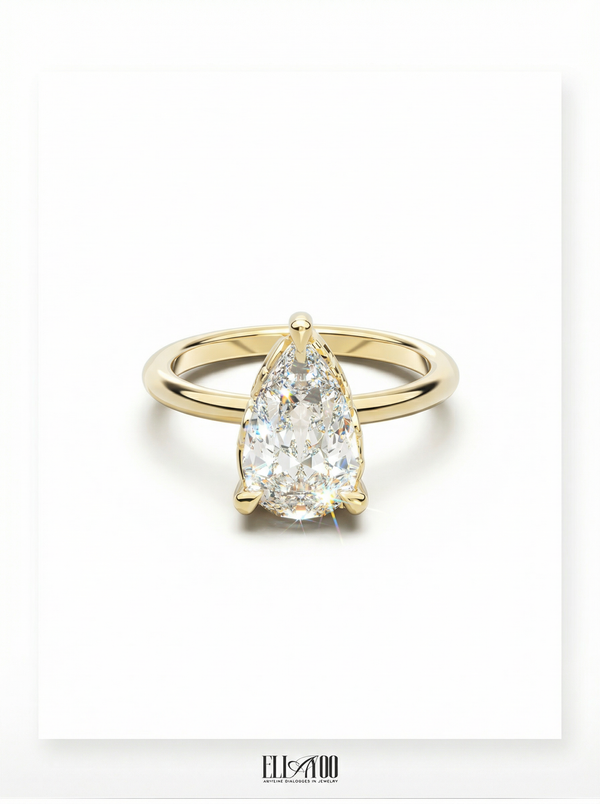 Front view of Pear Cut Diamond Ring with claw setting featuring initials on the side