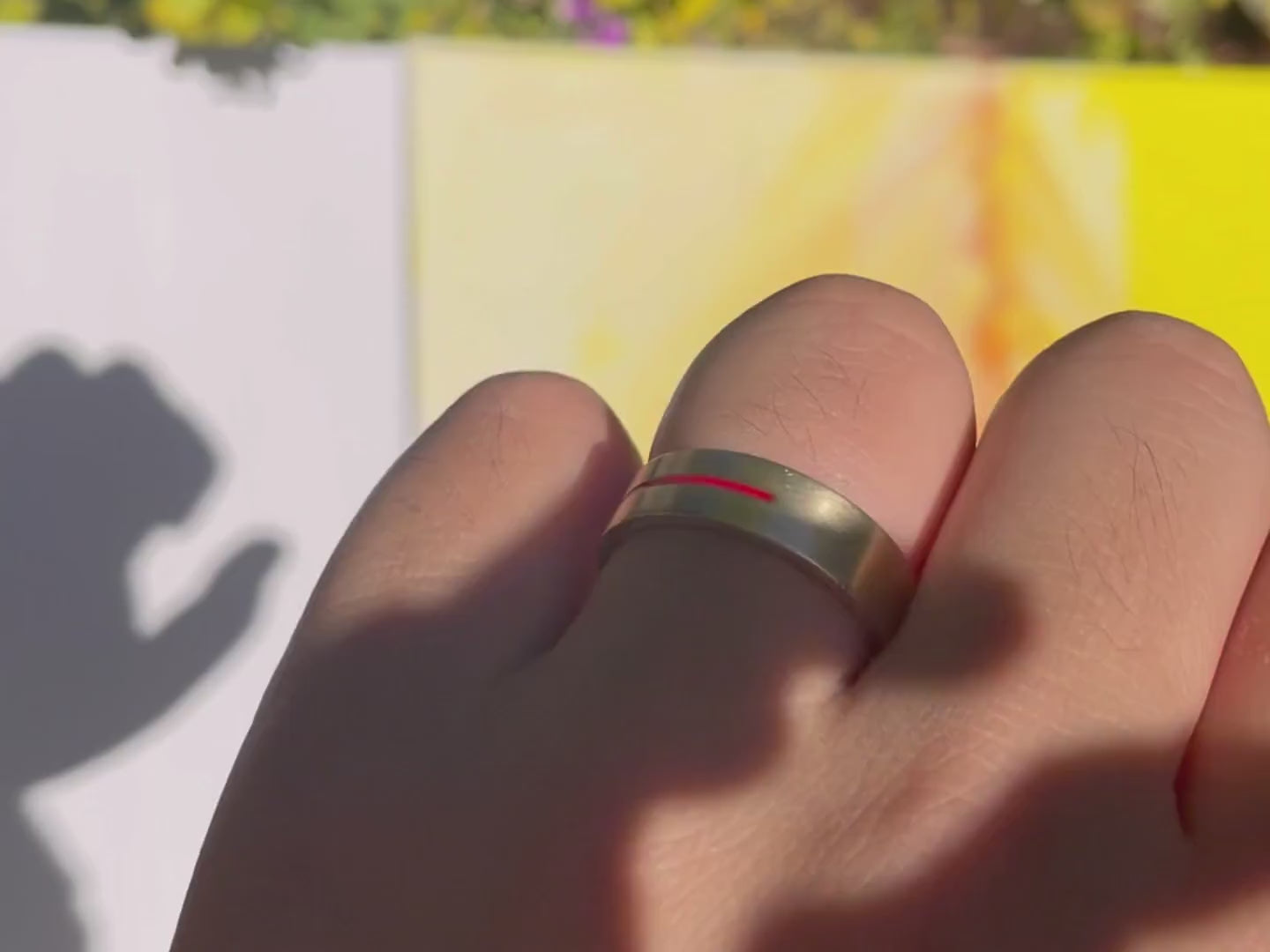 Model wearing Men's Gold ring with a red stripe