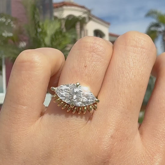 video of ella yoo artistic yellow gold marquise-cut diamond ring with a unique sculptural coiled wire setting, modern fine jewelry design.