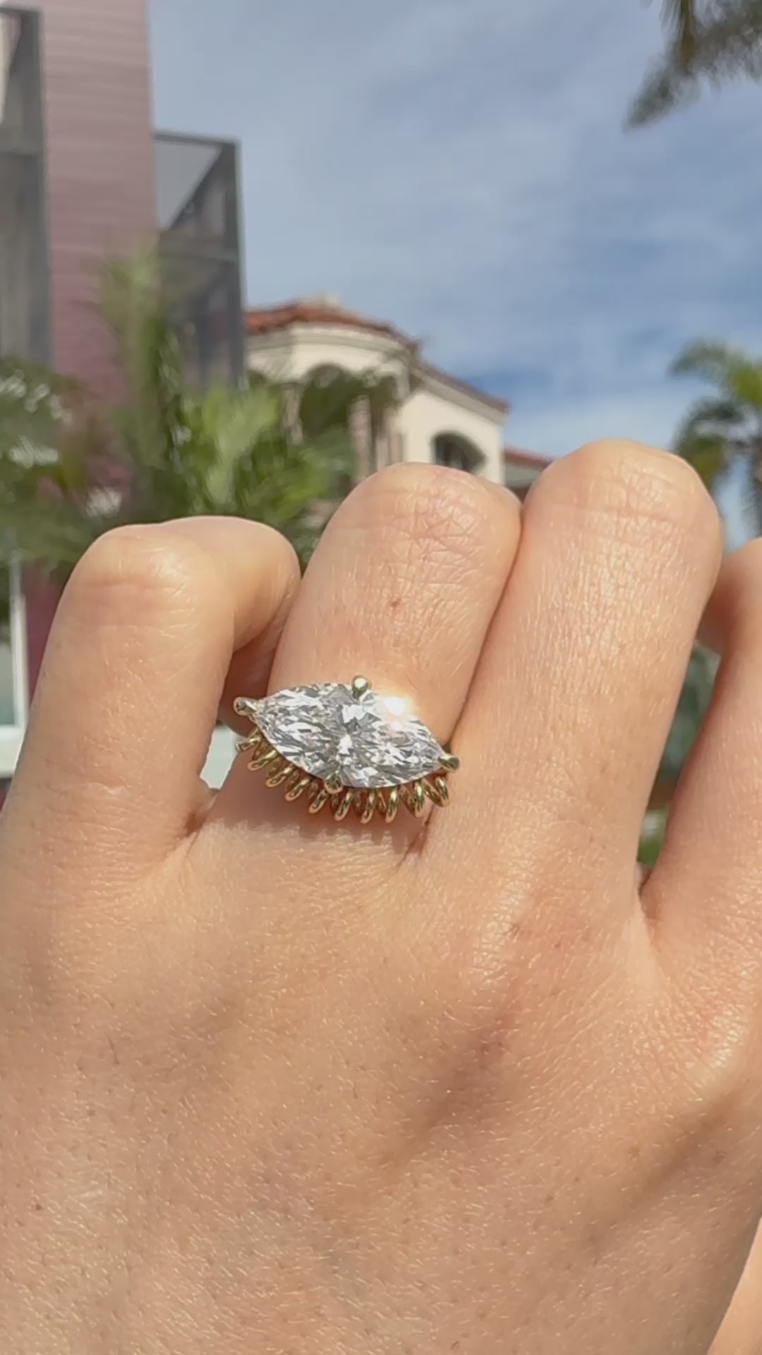 video of ella yoo artistic yellow gold marquise-cut diamond ring with a unique sculptural coiled wire setting, modern fine jewelry design.