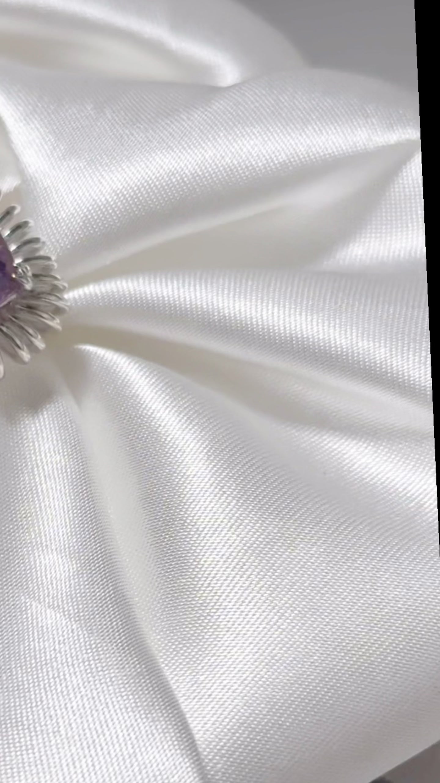 lifestyle video of Elongated Cushion cut Amethyst ring with sculptural silver petal setting, contemporary art-inspired design