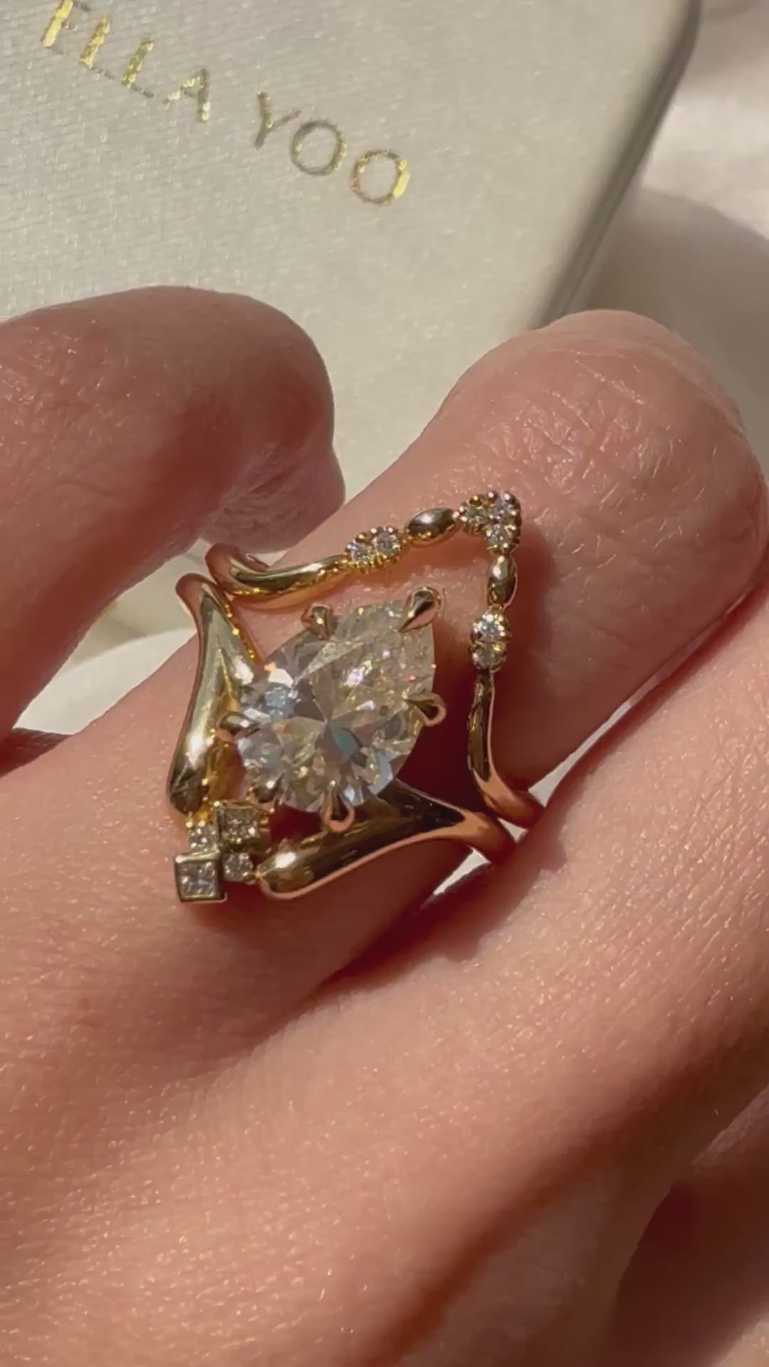 Video showing the engagement ring on model's hand
