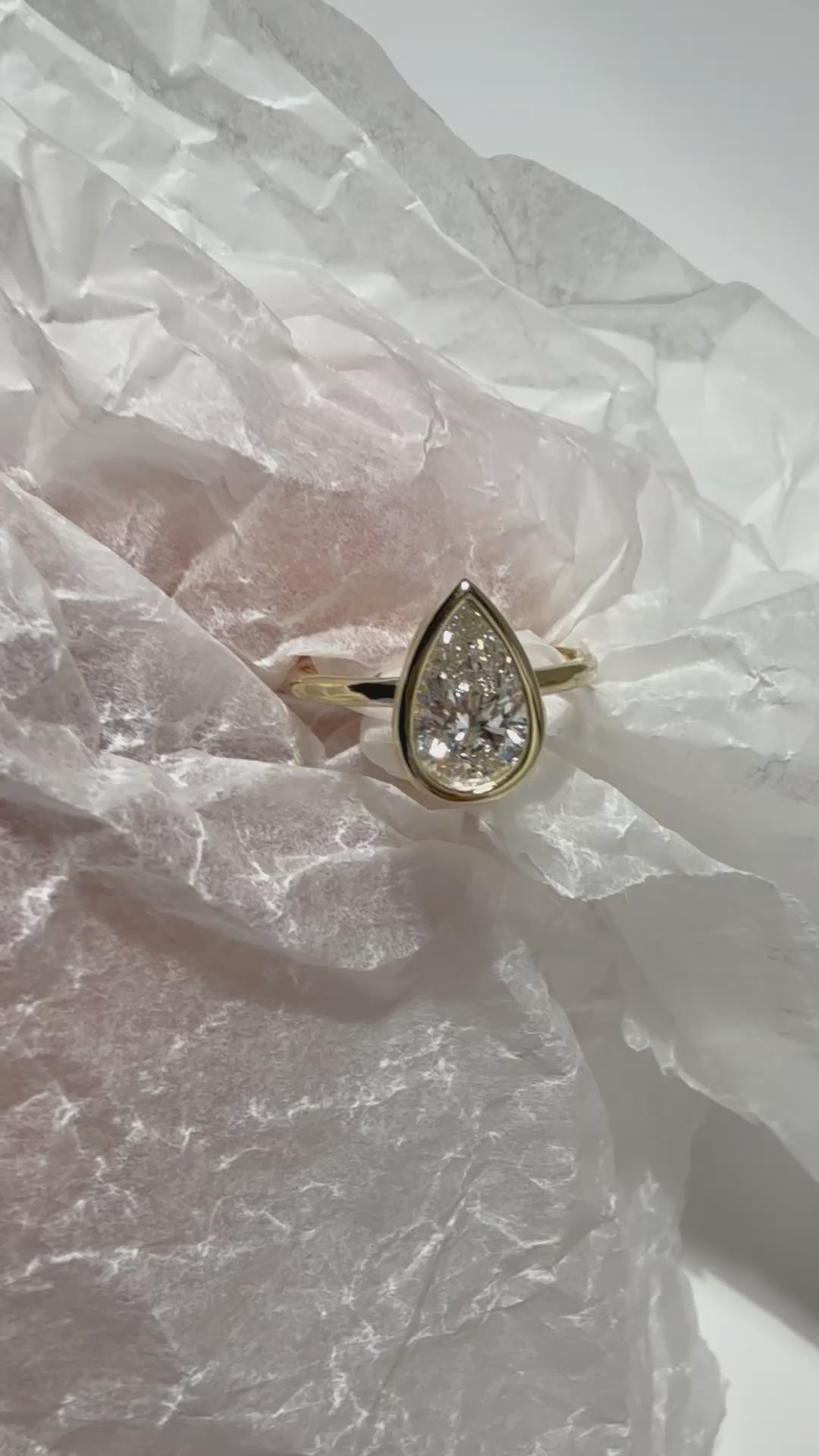 video of Pear Cut Diamond Ring with bezel setting featuring initials on the side